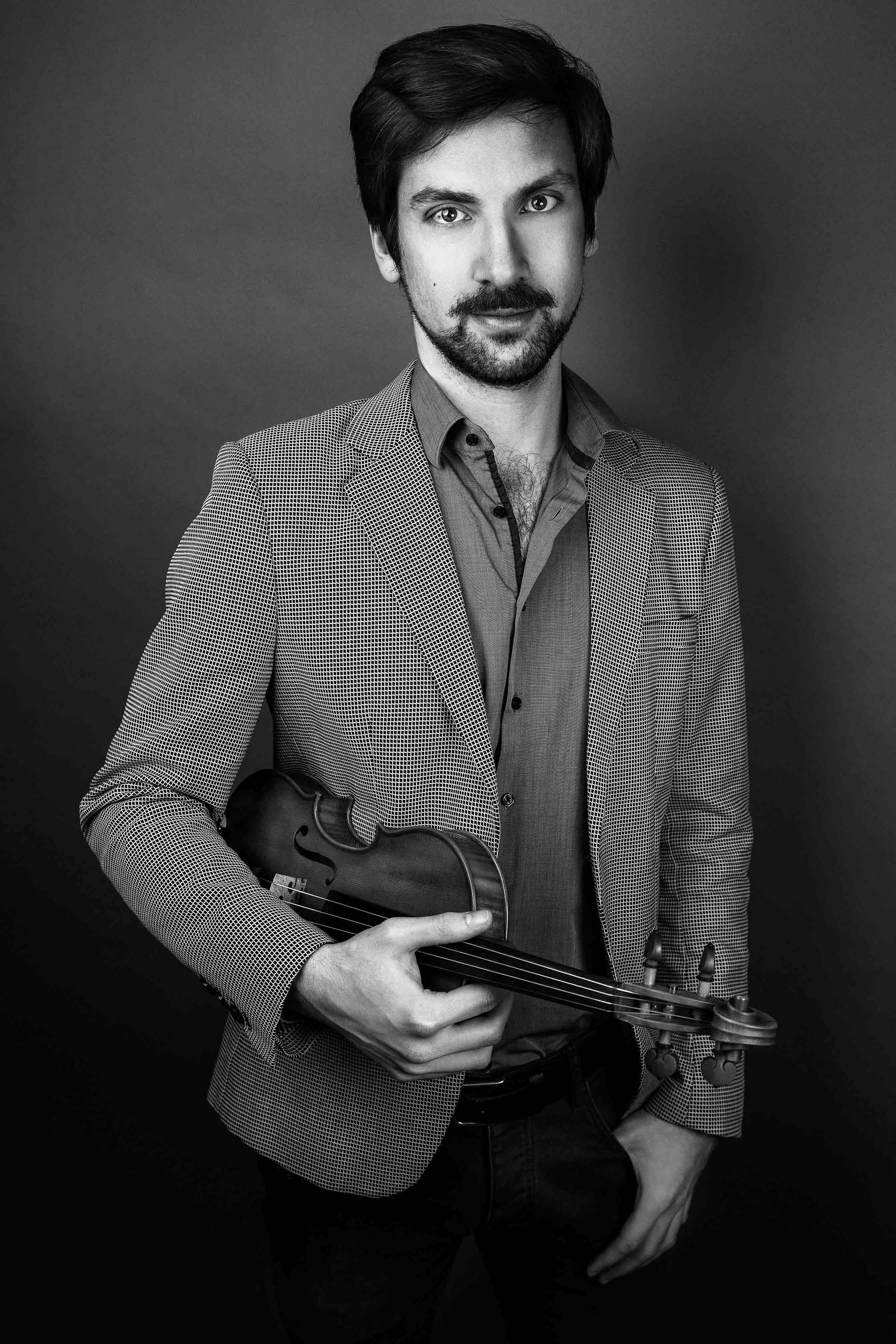 Violinist black and white portrait with his violin