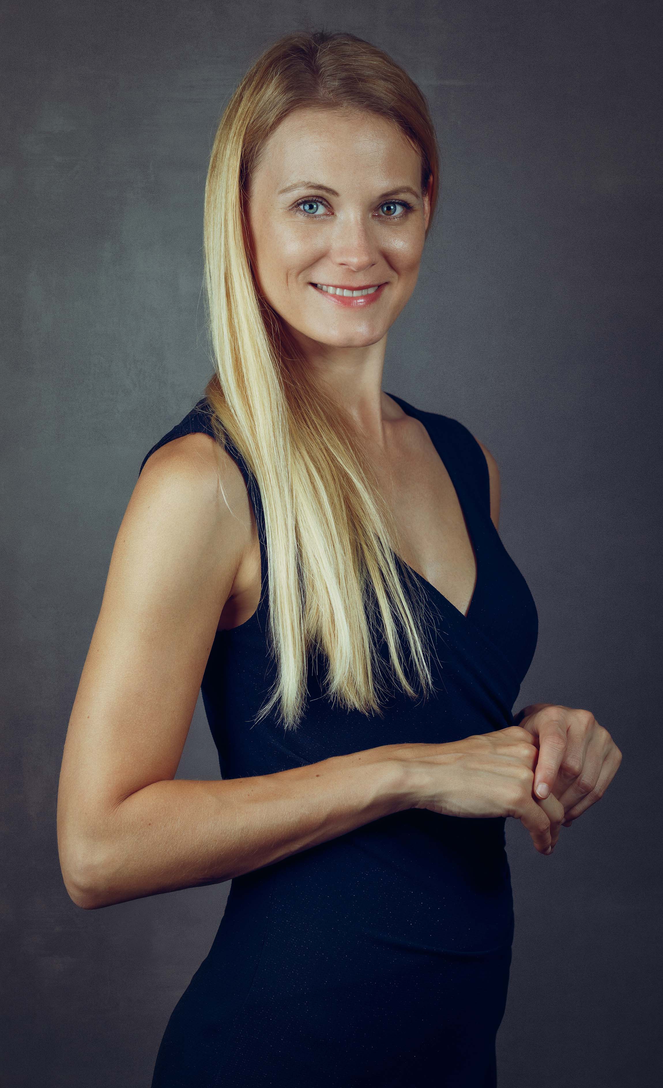 blond woman in black dress