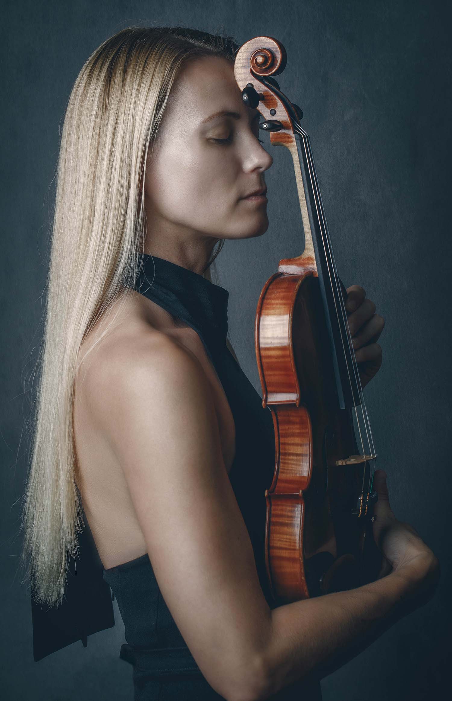 violinist with closed eyes and her violin